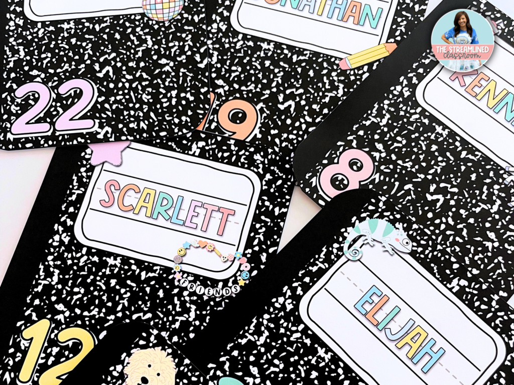 A set of black and white composition notebook-themed classroom labels featuring student names in a bright, pastel font. The labels include playful accents such as pencils, smiley faces, animals, and decorative charms. Each label has a unique number in the corner, making them ideal for organizing desks, cubbies, or supplies.