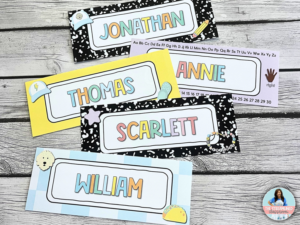 A set of vibrant, editable student desk name tags with fun, pastel designs. Each tag features a student’s name in a bold, colorful font, framed with playful decorations like hats, stars, and Crocs shoes. Some tags include a mini alphabet and number line for reference. The backgrounds vary, with patterns including black and white speckles, yellow, and checkered designs.