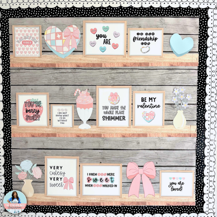 A real classroom bulletin board featuring framed Valentine’s quotes, pastel bows, and candy hearts arranged on wood-look printable shelves. The display has a black-and-white polka dot border for a stylish finish.