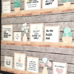 Wood-themed classroom bulletin board featuring framed motivational quotes, pastel plant accents, and a black-and-white scalloped border. Includes phrases like "Be the nice kid" and "Choose kindness" for an uplifting, boho classroom decor look.