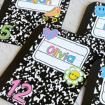 Printed and cut retro composition notebook locker tags for students Elijah, Noah, Olivia, and Scarlett, each with colorful clipart and numbers.