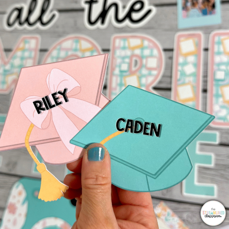 Two colorful graduation caps labeled 'Riley' and 'Caden,' held up against the bulletin board background. One cap is pink with a bow, and the other is teal with a tassel.