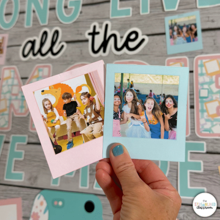 Two printed student photo Polaroids—one featuring a group of young students on stage, and the other with smiling girls in dress-up clothes—held in front of a pastel bulletin board that says 'Long Live All the Memories We Made.'
